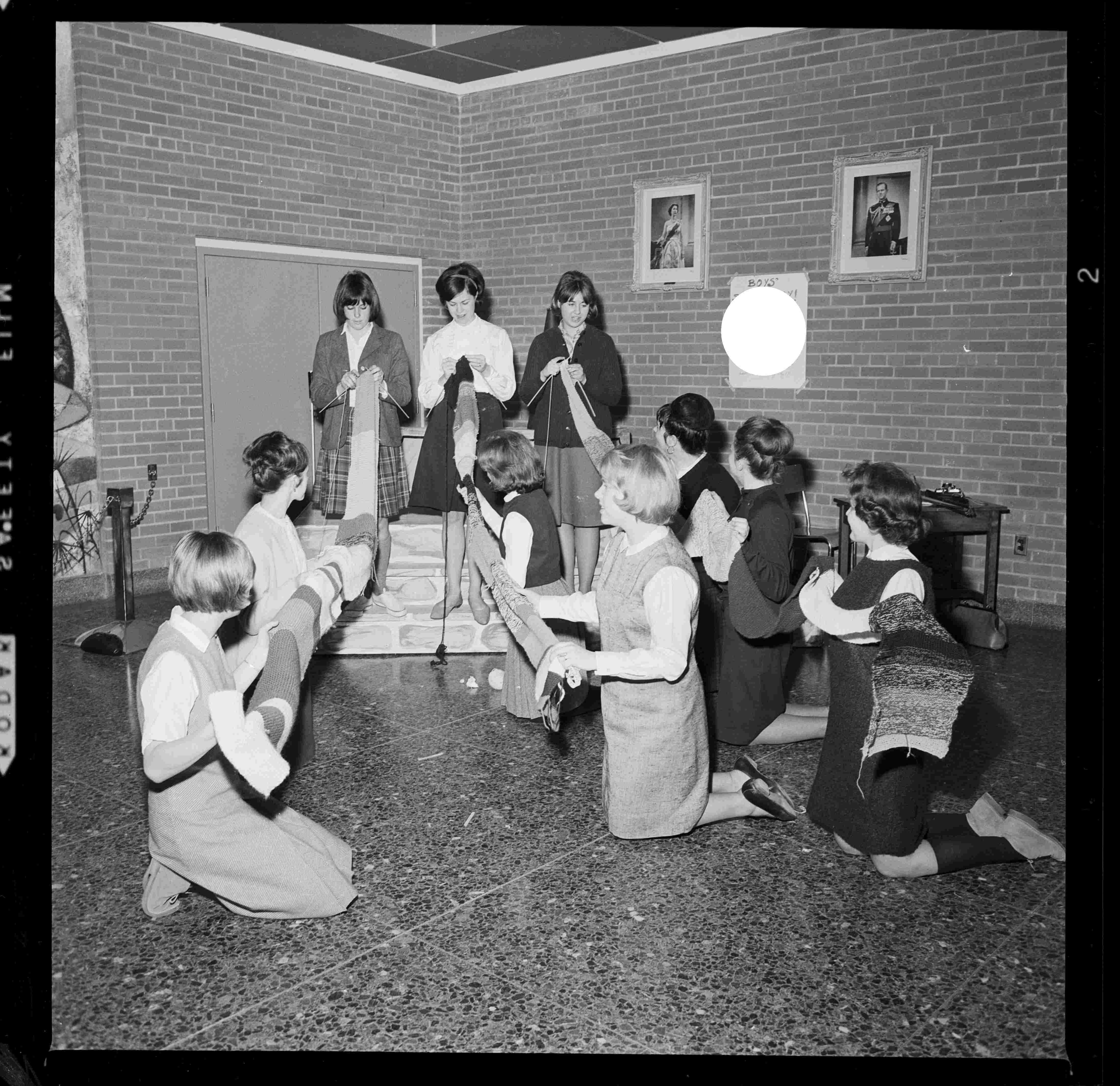 Group of high school students knitting